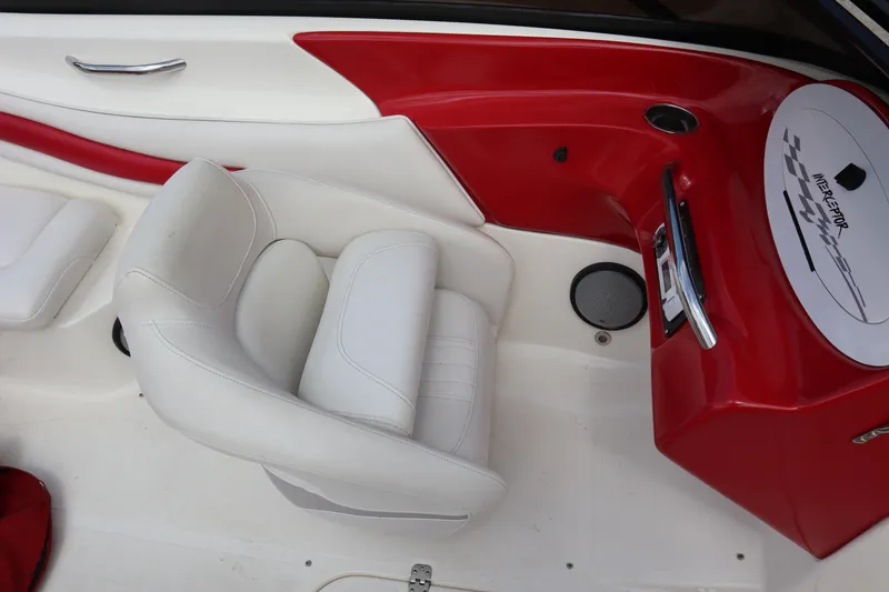 Slide: The Image of 2007 Caravelle Interceptor 232SS Bow Rider interior with white seating and red accents. - 17