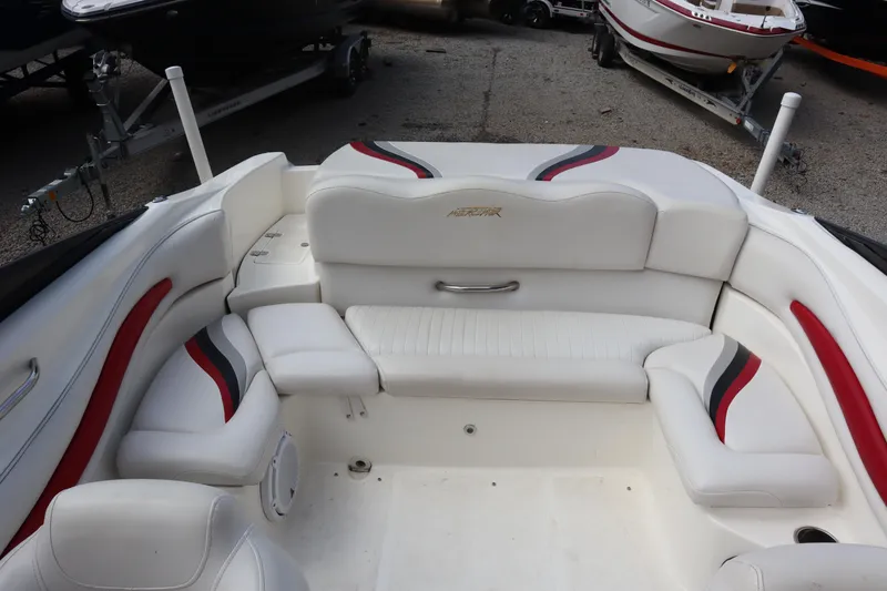 Slide: The Image of 2007 Caravelle Interceptor 232SS Bow Rider interior with white and red seating. - 20
