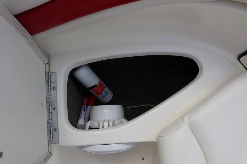 Slide: The Image of Storage compartment in 2007 Caravelle Interceptor 232SS Bow Rider with cleaning supplies. - 21