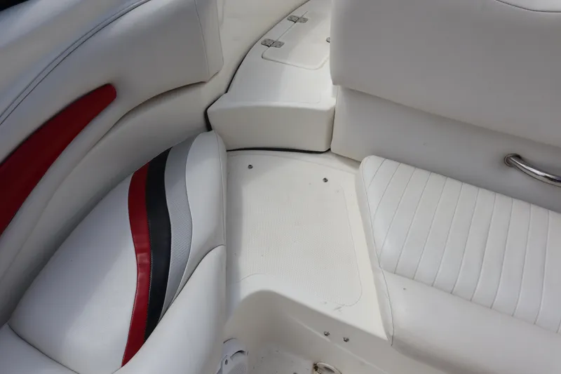 Slide: The Image of 2007 Caravelle Interceptor 232SS Bow Rider interior with white and red seating. - 22