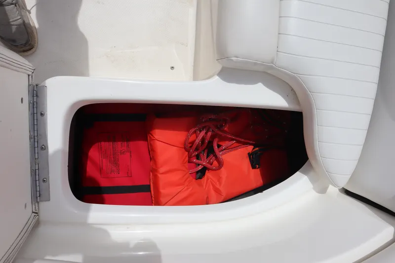 Slide: The Image of Storage compartment in 2007 Caravelle Interceptor 232SS Bow Rider with life jackets and ropes. - 26