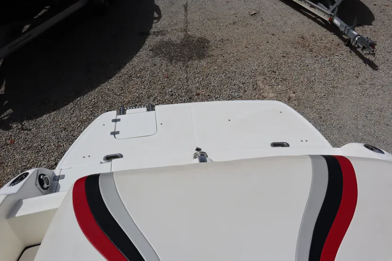 Slide: The Image of 2007 Caravelle Interceptor 232SS Bow Rider boat, rear view with red and black seat accents. - 27