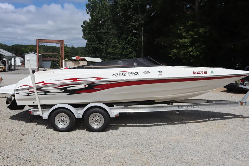 Slide: The Image of 2007 Caravelle Interceptor 232SS Bow Rider on trailer, featuring sleek design and vibrant graphics. - 3