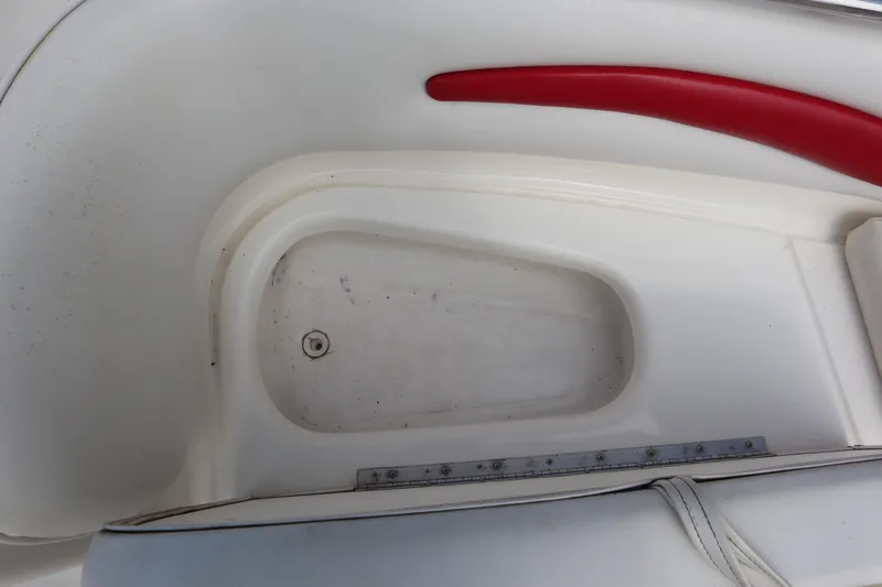 Slide: The Image of Interior of 2007 Caravelle Interceptor 232SS Bow Rider, featuring white and red seating. - 5