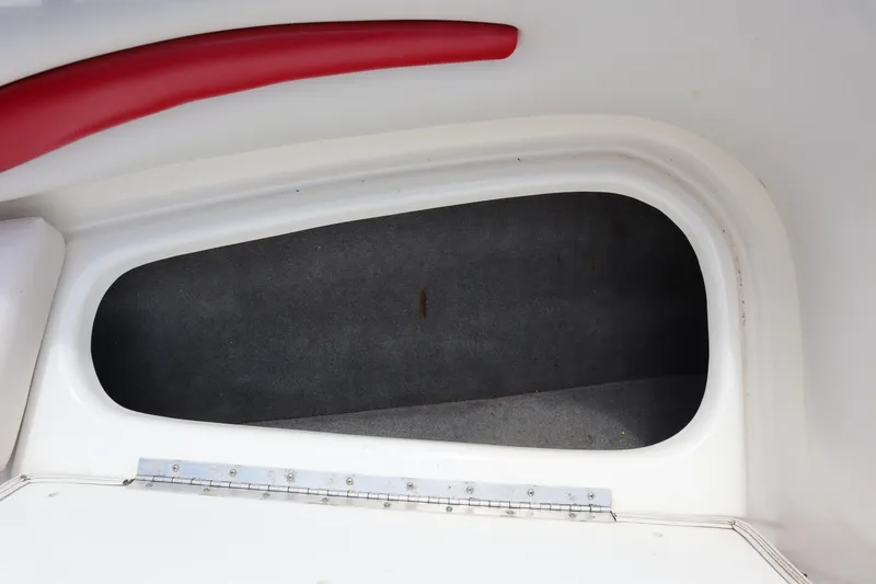 Slide: The Image of Storage compartment in a 2007 Caravelle Interceptor 232SS Bow Rider boat. - 7