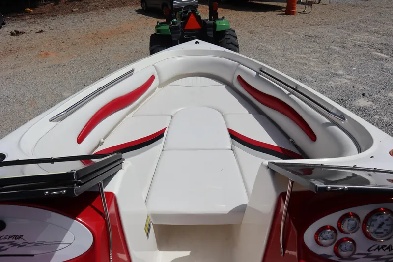 Slide: The Image of 2007 Caravelle Interceptor 232SS Bow Rider with red and white interior seating. - 8
