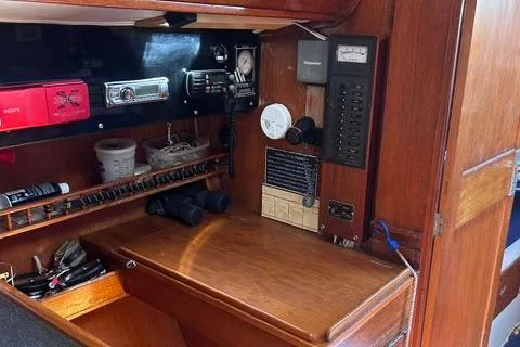 Slide: The Image of 1972 Cheoy Lee Offshore 47 Yawl navigation station with radio, instruments, and storage. - 10