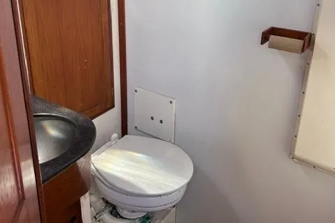 Slide: The Image of 1972 Cheoy Lee Offshore 47 Yawl bathroom with sink and toilet. - 17