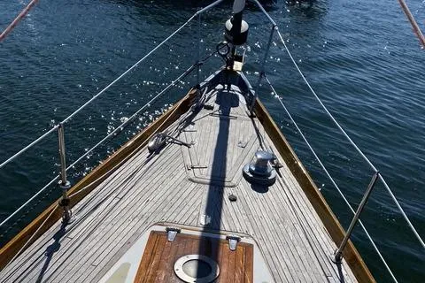 Slide: The Image of 1972 Cheoy Lee Offshore 47 Yawl deck, sailing on calm waters. - 20