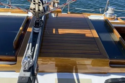 Slide: The Image of 1972 Cheoy Lee Offshore 47 Yawl deck with polished wood finish and rigging details. - 25