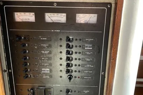 Slide: The Image of Electrical panel of a 1972 Cheoy Lee Offshore 47 Yawl sailboat, featuring various switches and gauges. - 30