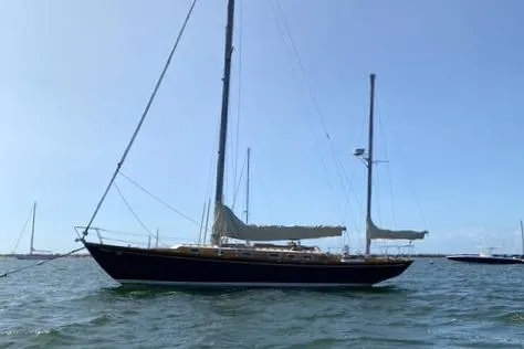 Slide: The Image of 1972 Cheoy Lee Offshore 47 Yawl sailing on calm waters under clear skies. - 31