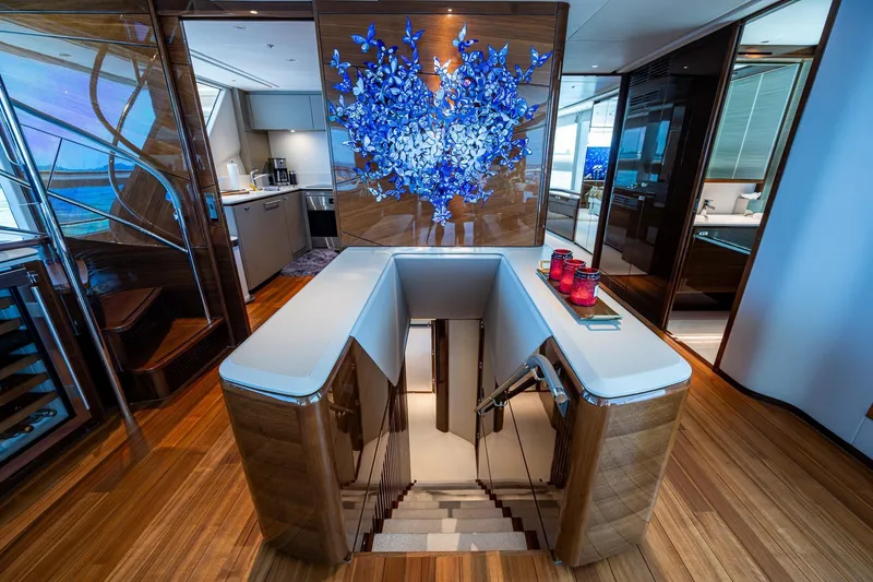Slide: The Image of Luxurious interior of 2022 Princess X95 yacht with elegant staircase and modern decor. - 24