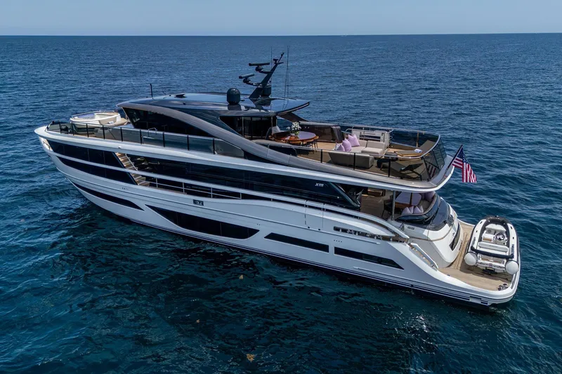 Slide: The Image of Luxury 2022 Princess X95 yacht cruising on open sea, featuring sleek design and spacious decks. - 40