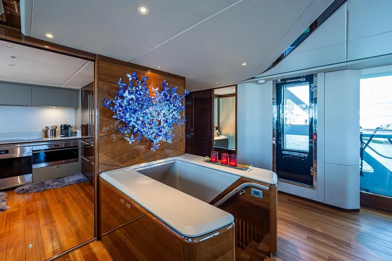 Slide: The Image of Luxurious interior of 2022 Princess X95 yacht with modern kitchen and artistic decor. - 55