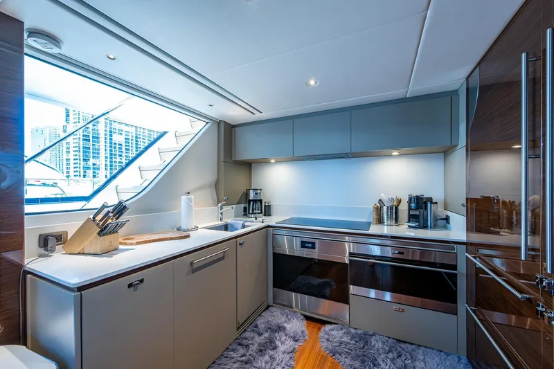 Slide: The Image of Luxurious 2022 Princess X95 yacht kitchen with modern appliances and sleek design. - 86