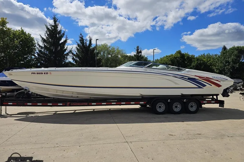 Slide: The Image of 2012 Formula 382 FASTech boat on trailer under blue sky. - 13