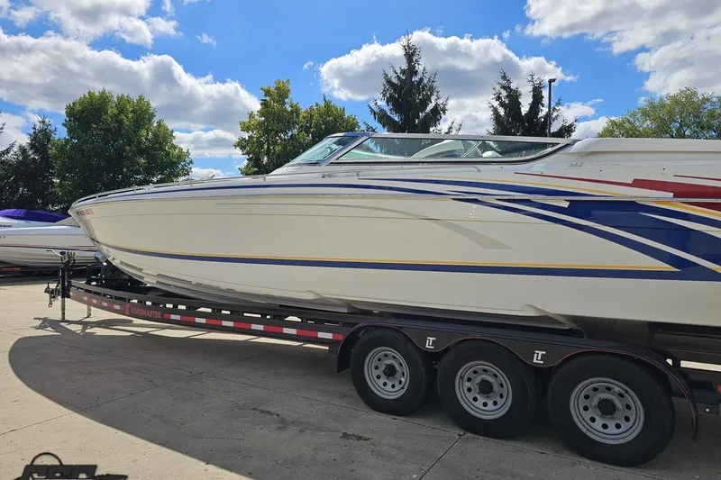 Slide: The Image of 2012 Formula 382 FASTech boat on trailer under blue sky with clouds. - 17