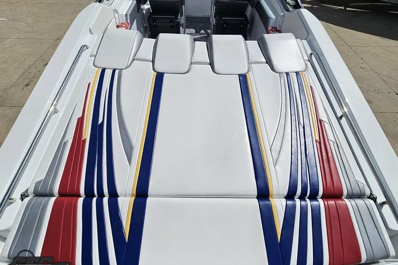 Slide: The Image of 2012 Formula 382 FASTech boat with colorful striped upholstery on deck. - 25