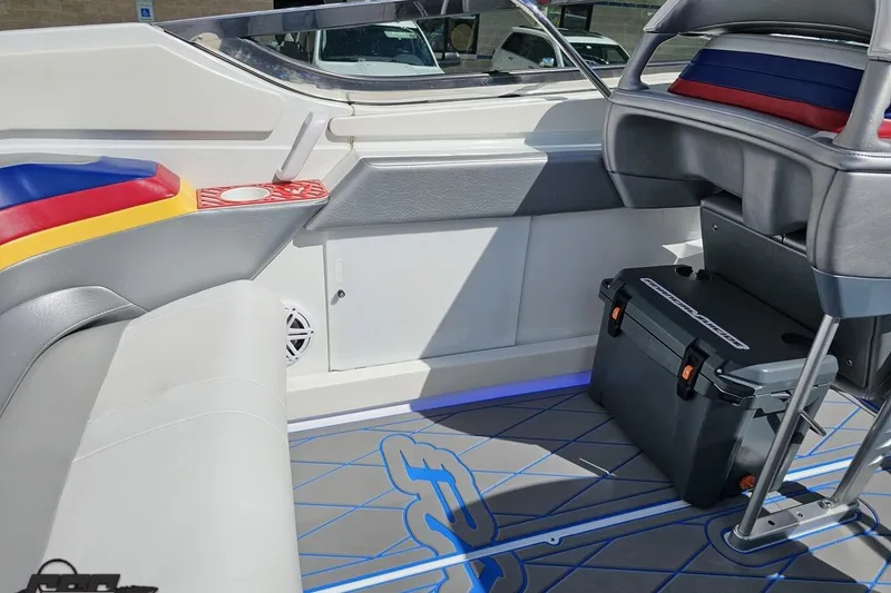 Slide: The Image of Interior of a 2012 Formula 382 FASTech boat with colorful seating and storage. - 36