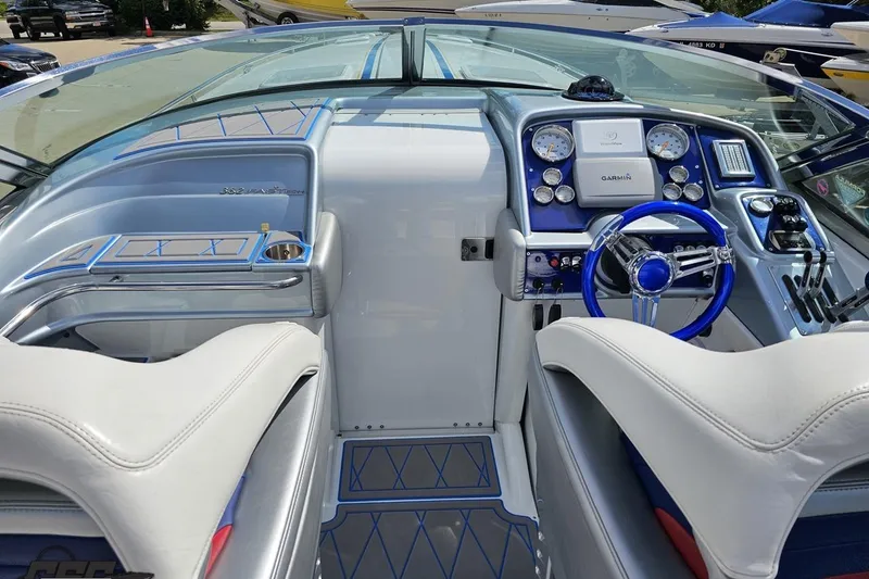Slide: The Image of Interior of a 2012 Formula 382 FASTech boat with modern dashboard and steering wheel. - 38