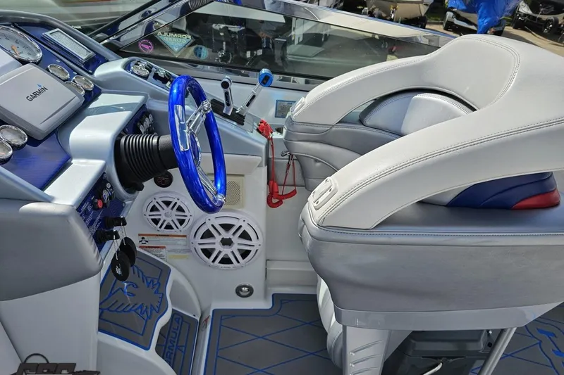 Slide: The Image of 2012 Formula 382 FASTech boat cockpit with blue steering wheel and modern controls. - 43