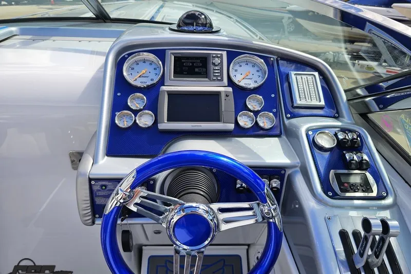 Slide: The Image of Dashboard of a 2012 Formula 382 FASTech boat with blue accents and gauges. - 44