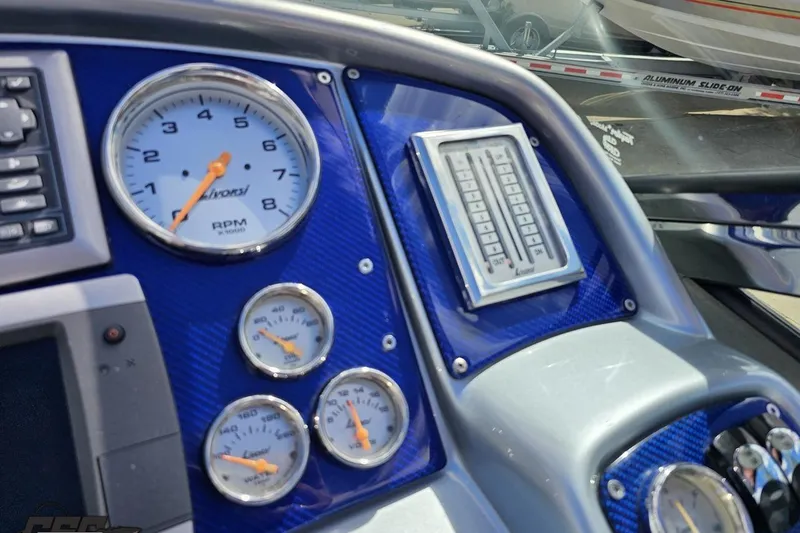 Slide: The Image of Dashboard of 2012 Formula 382 FASTech with gauges and controls. - 49