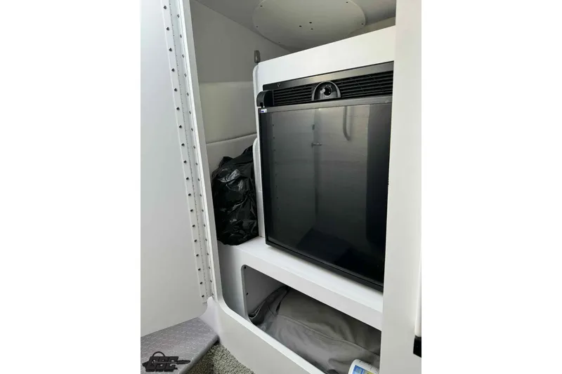 Slide: The Image of 2012 Formula 382 FASTech cabin interior with compact refrigerator and storage space. - 57