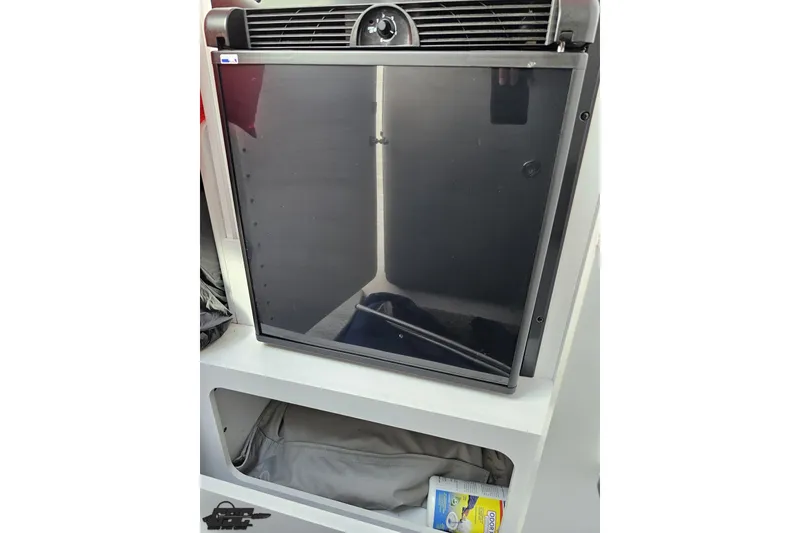 Slide: The Image of 2012 Formula 382 FASTech interior fridge with storage compartment below. - 58