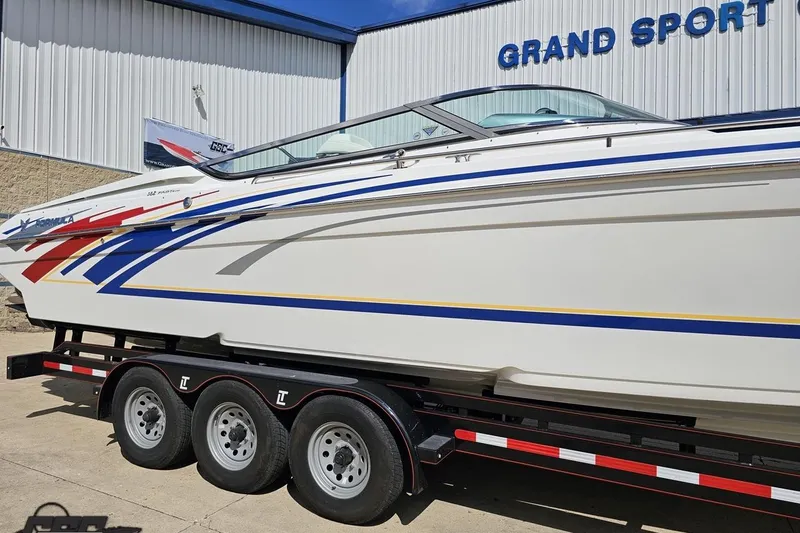 Slide: The Image of 2012 Formula 382 FASTech boat on trailer at Grand Sport dealership. - 6