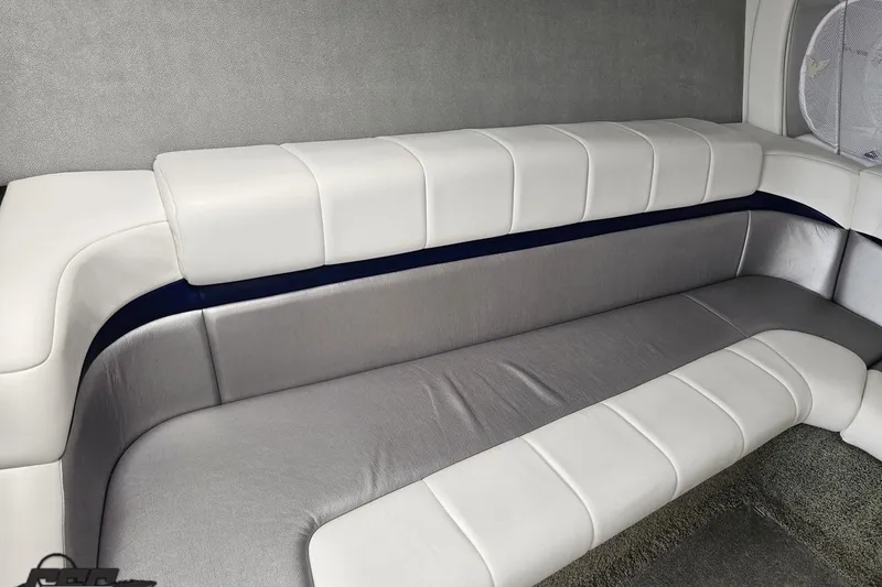 Slide: The Image of Luxurious interior seating of 2012 Formula 382 FASTech boat, featuring sleek white and gray upholstery. - 60