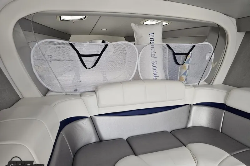 Slide: The Image of Interior of 2012 Formula 382 FASTech boat with cushioned seating and storage nets. - 61