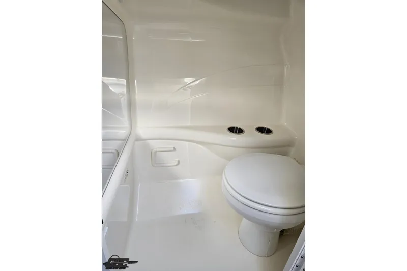 Slide: The Image of 2012 Formula 382 FASTech boat bathroom with white interior and toilet. - 66