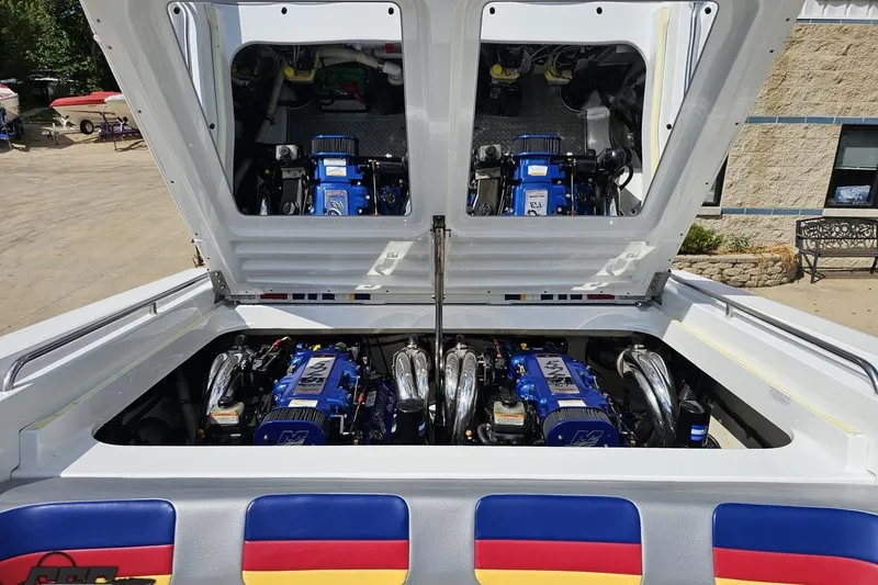 Slide: The Image of 2012 Formula 382 FASTech boat engine compartment with dual blue engines. - 76