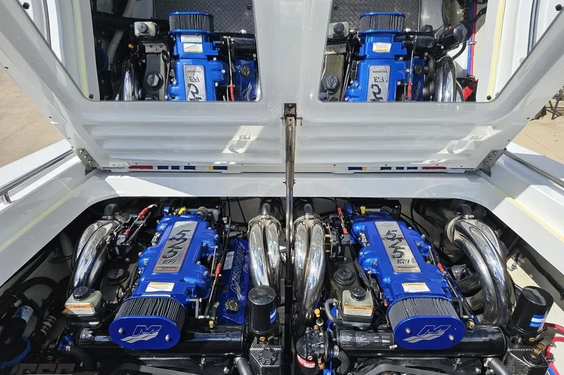 Slide: The Image of 2012 Formula 382 FASTech boat engine compartment with dual Mercury engines. - 77