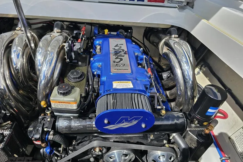 Slide: The Image of 2012 Formula 382 FASTech engine with blue Mercury 525 EFI, chrome headers, and performance components. - 79