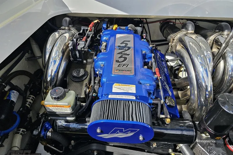 Slide: The Image of 2012 Formula 382 FASTech engine with blue Mercury 525 EFI, chrome headers, and performance components. - 80