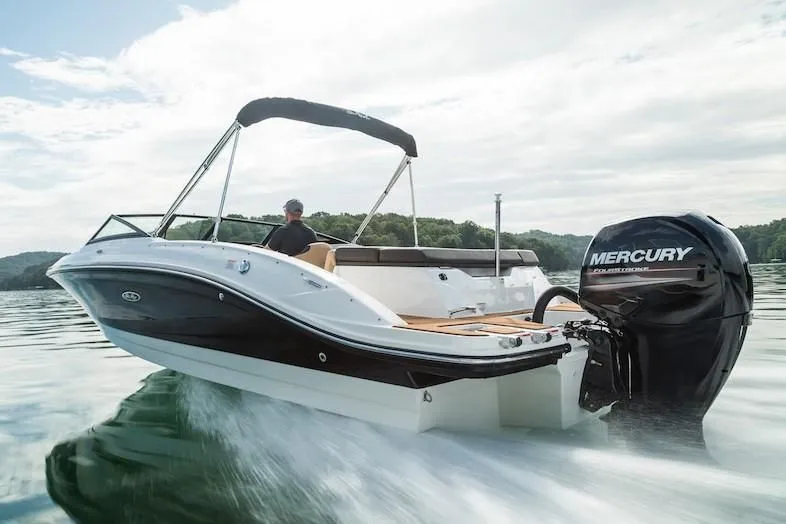 Slide: The Image of 2019 Sea Ray SPX 210 OB boat cruising on a lake. - 25