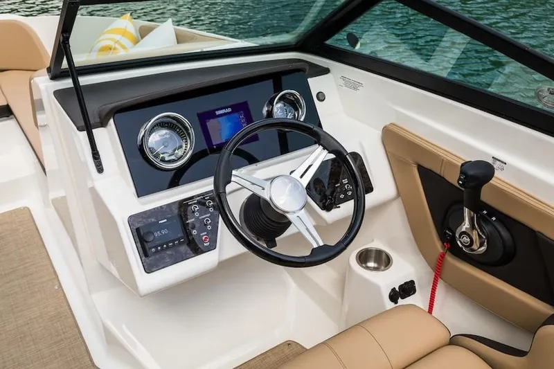 Slide: The Image of 2019 Sea Ray SPX 210 OB boat dashboard with steering wheel and control panel. - 29