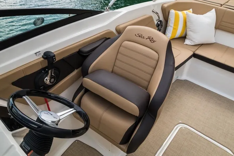 Slide: The Image of 2019 Sea Ray SPX 210 OB boat interior with captain's chair and seating area. - 30