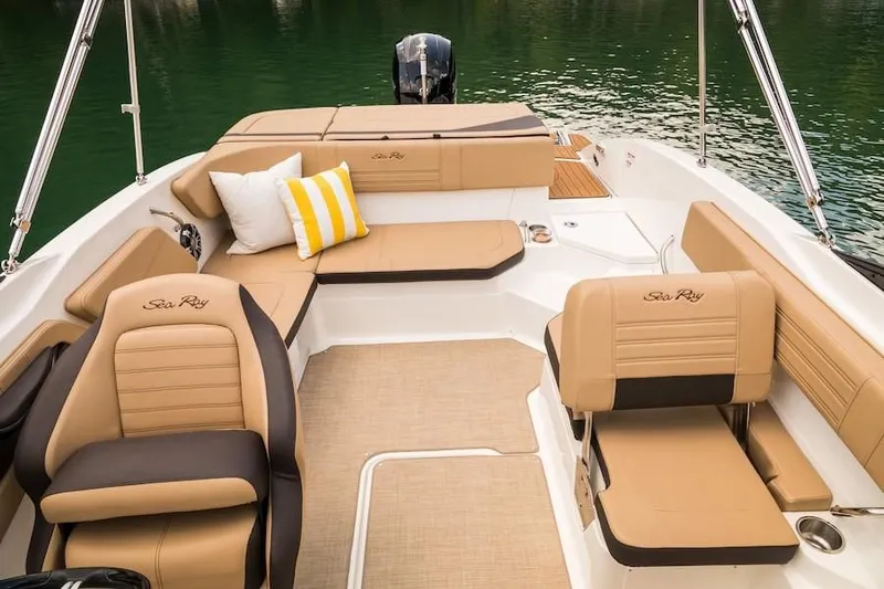 Slide: The Image of 2019 Sea Ray SPX 210 OB boat interior with tan seating and lake view. - 33