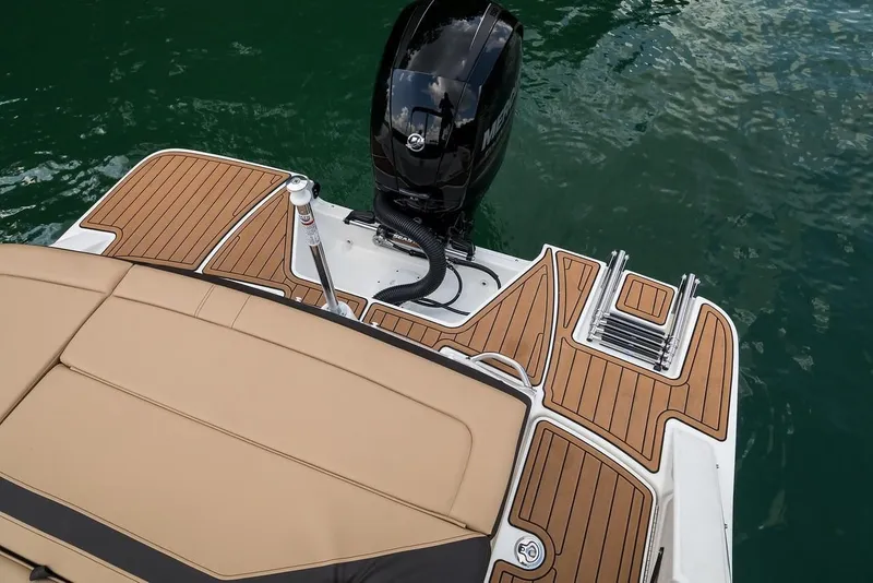 Slide: The Image of 2019 Sea Ray SPX 210 OB boat with teak deck and outboard motor. - 36