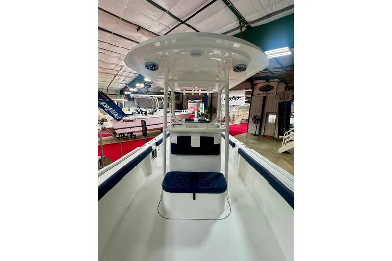 Slide: The Image of 2026 Parker 23SE Center Console boat interior at a showroom display. - 11