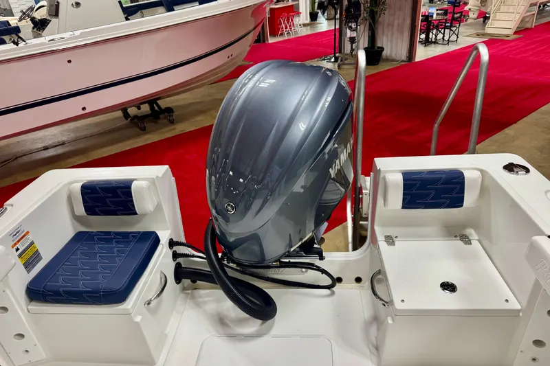 Slide: The Image of 2026 Parker 23SE Center Console boat with Yamaha outboard motor at a boat show. - 7
