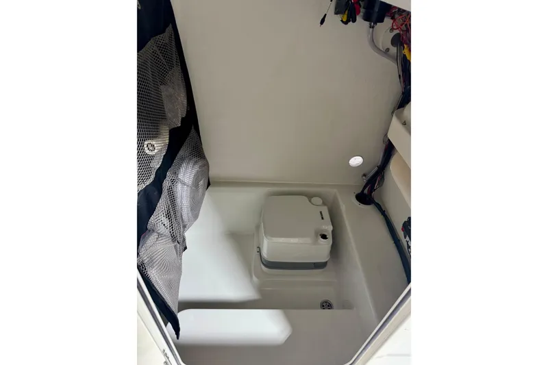 Slide: The Image of Interior of 2026 Parker 23SE Center Console boat with storage compartment. - 9