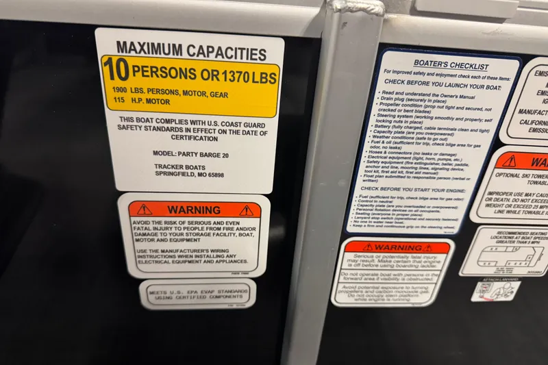 Slide: The Image of 2026 Sun Tracker Party Barge 20 DLX capacity and safety labels, including warnings and boater's checklist. - 12