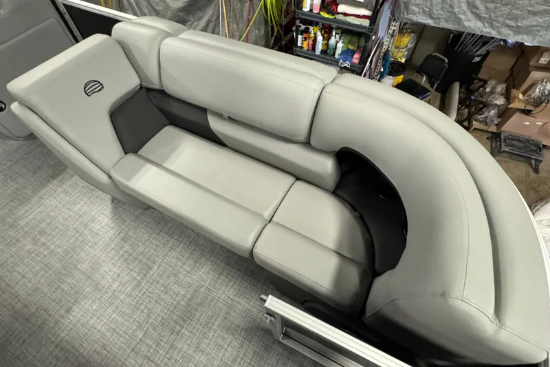 Slide: The Image of 2026 Sun Tracker Party Barge 20 DLX, featuring luxurious gray seating. - 8