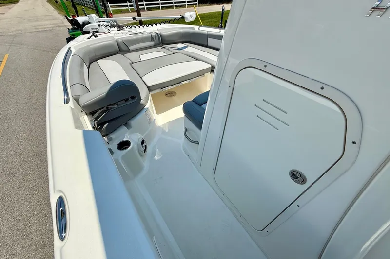 Slide: The Image of 2022 NauticStar 251 Hybrid boat interior with seating and storage compartment. - 13