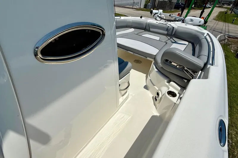 Slide: The Image of 2022 NauticStar 251 Hybrid boat interior with cushioned seating and sleek design. - 16